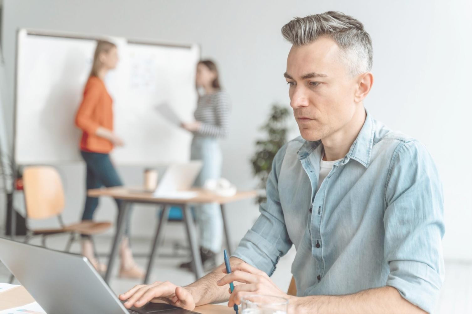 Professional analyzing business data with focused attention to detail